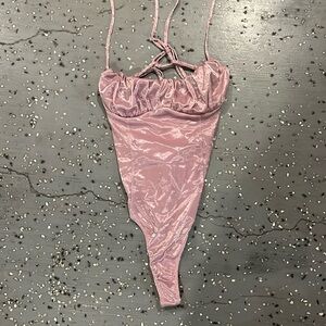 Urban outfitters bodysuitt sparkly and light purple. Size:s